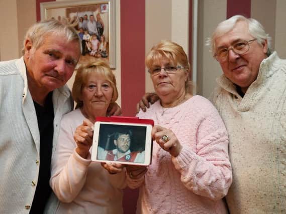 Parents Bob Taylor, Ann Taylor, Maureen Crowder and Norman Crowder with a photograph of Darren