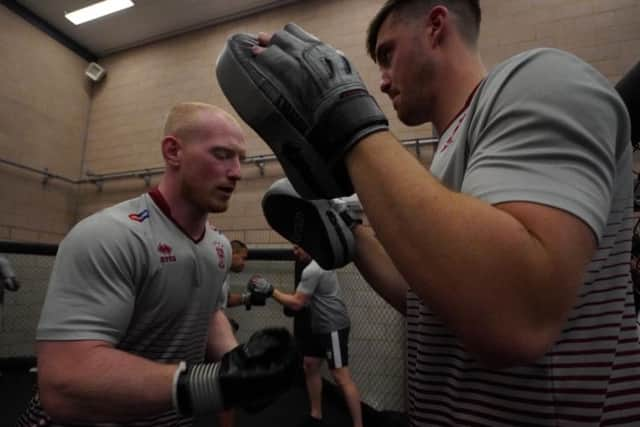 Liam Farrell and Joe Greenwood hitting the pads yesterday