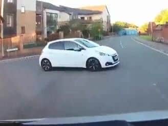The White Peugeot can be seen pulling out in front of the motorist, who caught it all on dash cam