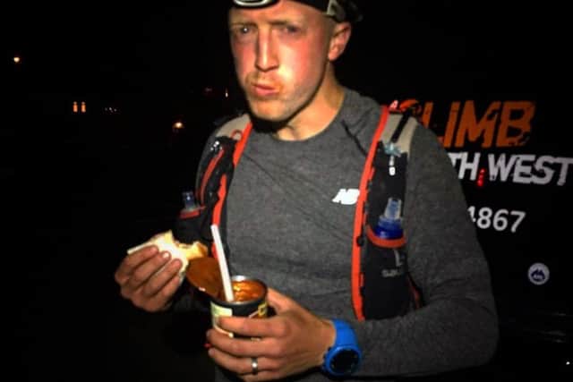 Dan eating a cold tin of beans during the race