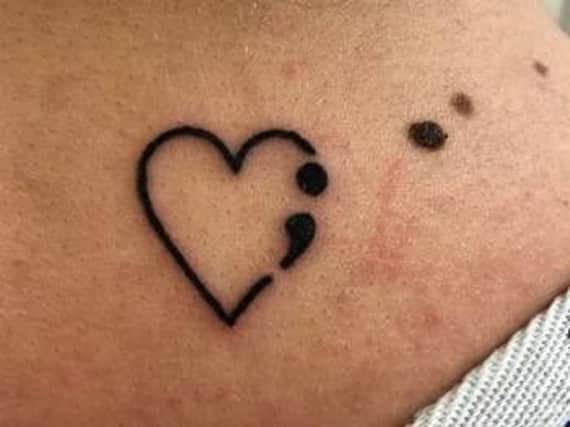 Zoe Greenall's semicolon tattoo, raising awareness of mental illness and suicide prevention