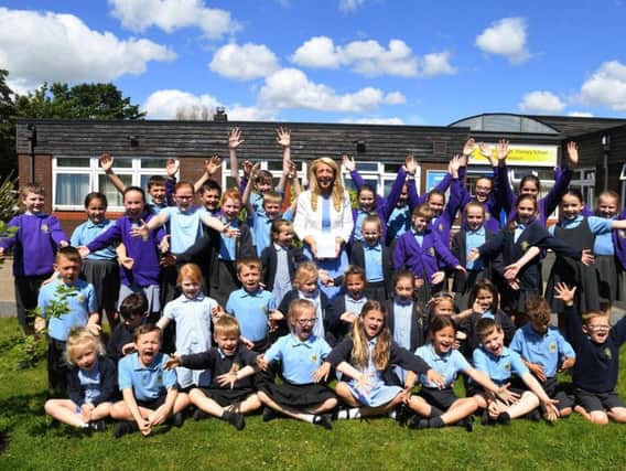 Sharon celebrating with pupils at St Peter's Primary School