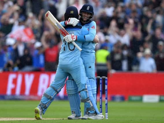 England's captain Eoin Morgan (l) and England's Joe Root celebrate victory during the 2019 Cricket World Cup second semi-final between England and Australia