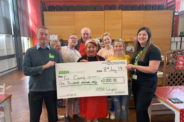 Fur Clemt receiving a 1,000 Local Impact Grant from ASDA Foundation