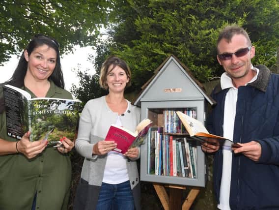 Samantha Anderson, Vikki Crompton and Corin Lomax, have created a free little library in the Ellen Higginbottom memorial garden