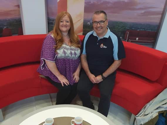 Francesca Lowe on the red sofa with Steve Carter