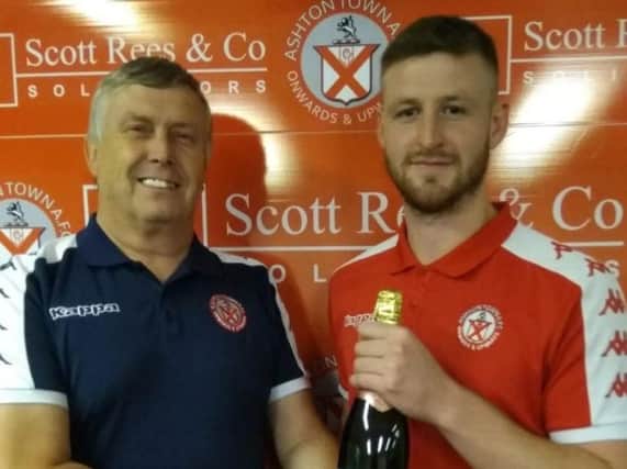 Dylan Glass being presented with his man-of-the match award by Town volunteer Stefan Ochwat