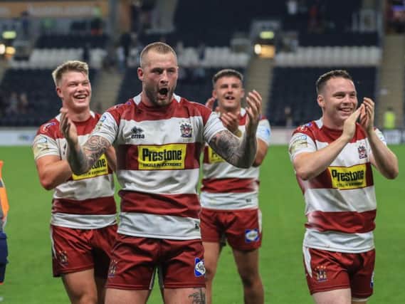 Zak Hardaker leads the celebrations after the win at Hull FC