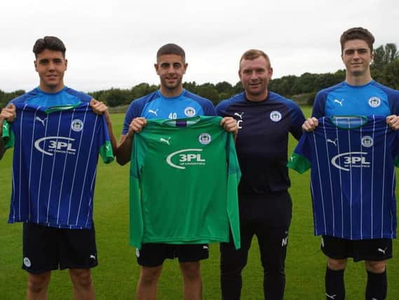 Nick Chadwick welcomes his three new signings to Wigan Athletic