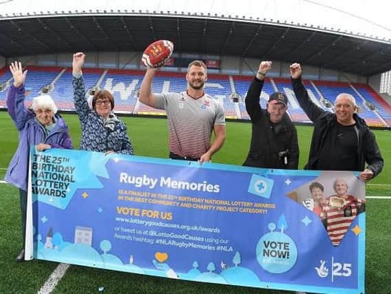 Wigan Warriors captain Sean OLoughlin, visiting the National Lottery funded project Rugby Memories, to support their bid to be named Best Community & Charity Project in the 25th Birthday National Lottery Awards