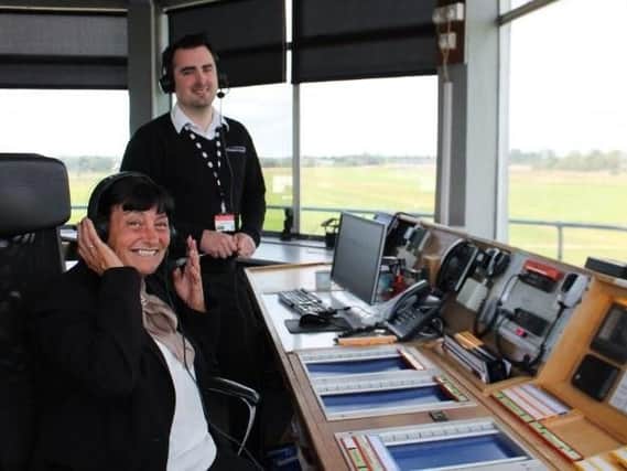Tanya Kinder learning air traffic control skills with Gareth White