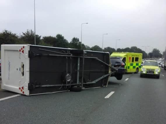 The overturned caravan on the M6