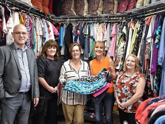 Councillors Paul Prescott, Eileen Rigby and Jeanette Prescott are shown the new Wigan MS Therapy Centre charity shop shop by fundraisers Heather Read and Janet Mather