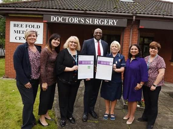 Staff at Bee Fold Medical Centre celebrate being awarded outstanding by the CQC, from left, receptionist Stephanie Jones, regional manager Victoria Westwood, office manager Tania Berry, Dr Adeyinka Adejumo, nurse Janet Raftry, Dr Shikha Pitalia and receptionist Alison Aspden