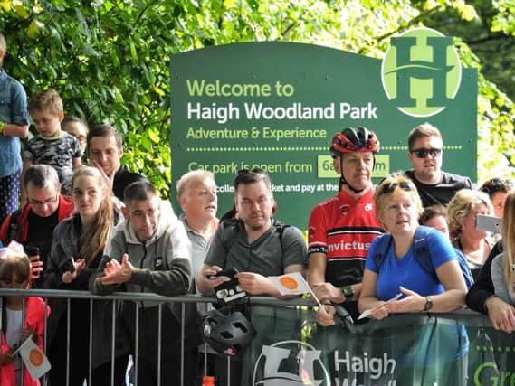 Supporters cheering on the riders at Haigh Hall