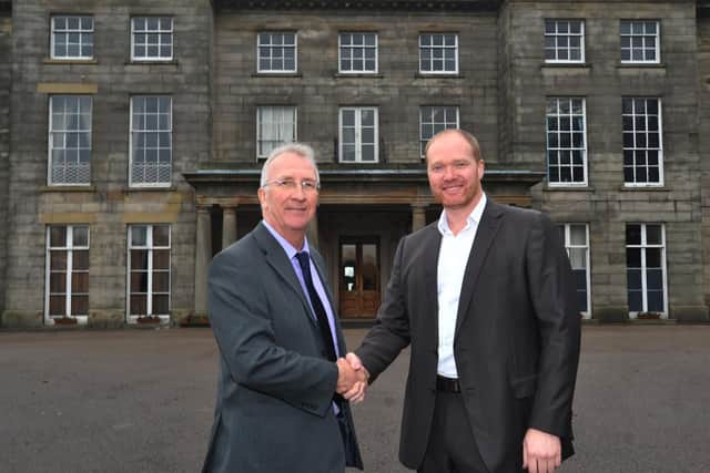 Council leader David Molyneux shakes hands with Craig Baker, director of Contessa Hotels, when the deal was first struck