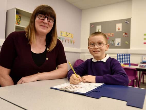 Headteacher Debbie Procter with a pupil at the new Holden School