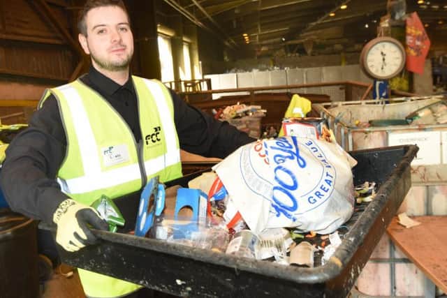 Reporter Liam Soutar helps out at the recycling centre in Ince