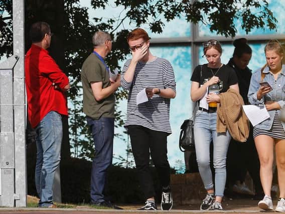 Workers leave the Thomas Cook Headquarters in Peterborough