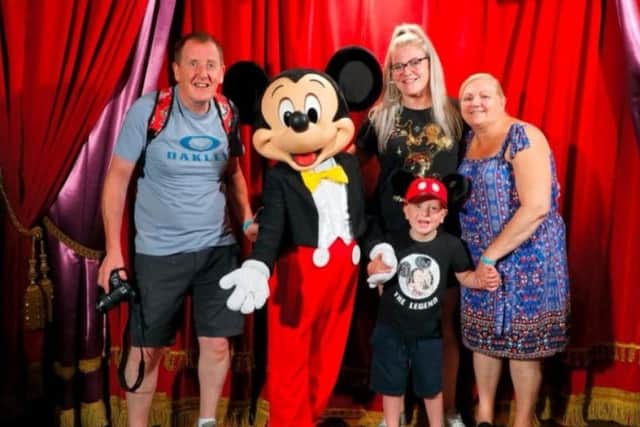 Bobby and his family at Disneyland Paris