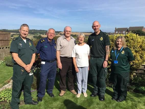 Tony and wife Janet (central) are reunited with left to right: Senior Paramedic Team Leader Damian Walsh, Community First Responder Peter Gregory, Paramedic Mark Jackson and Emergency Medical Dispatcher Shelley Buckley