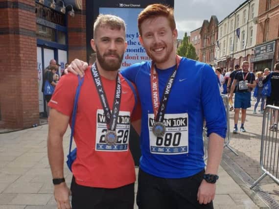 Andrew Fleming(left) with his nutritionist Sam McKenzie after the Wigan10k run in September.
