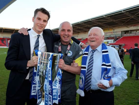 David Sharpe, Paul Cook and Dave Whelan celebrate promotion