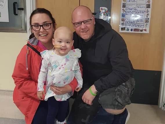 Ruby Rose Scotson with her parents Lacey and Tom