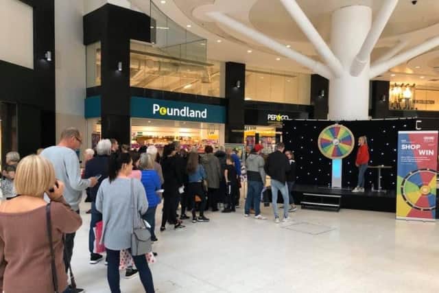 Shoppers line up for their chance to win a huge prize