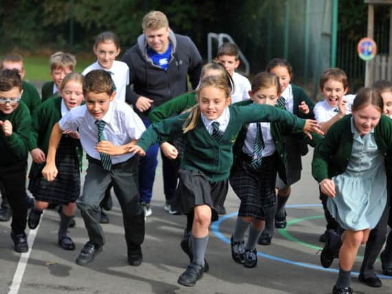 Pupils at Woodfield Primary School take part in the daily mile