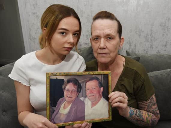 Sharon Gorst and daughter Ciara, 19, holding a photograph of Sharons father Brian Grounds