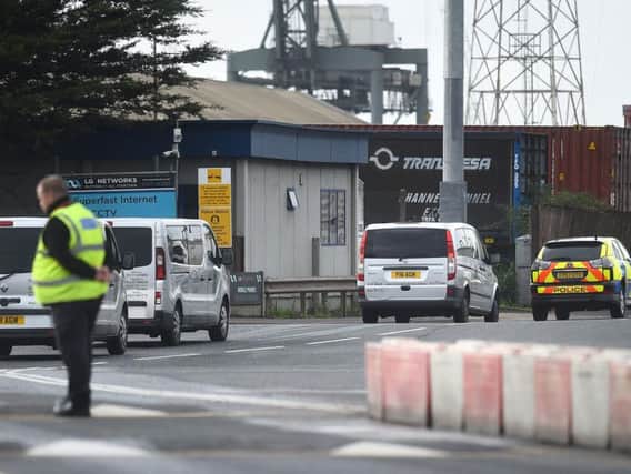 A convoy of funeral directors vehicles enter the Port of Tilbury to collect the bodies of the 39 people found inside a lorry in Essex to transport them to Broomfield Hospital in Chelmsford. Photo: Kirsty O'Connor/PA Wire