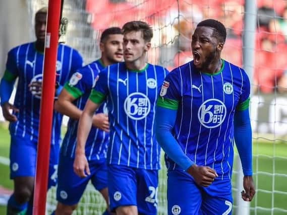 Chey Dunkley is congratulated after levelling for Latics at Bristol City