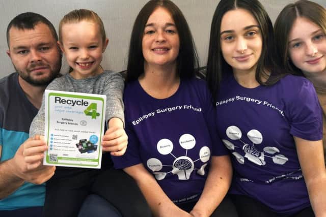 Kelly Blakeley (centre) with her family