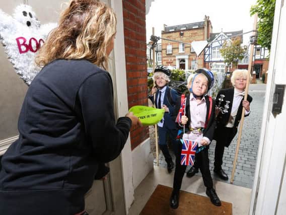 Jack Waterson, aged 7, Presley Kempson and Jamison McCarthy, both aged 10,  styled as three of the Prime Minister's most iconic looks; Zipwire Boris, Biking Boris and Bullingdon Boris