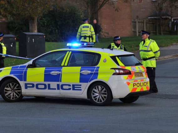 Police seal off Scholefield Lane after Monday afternoon's crash