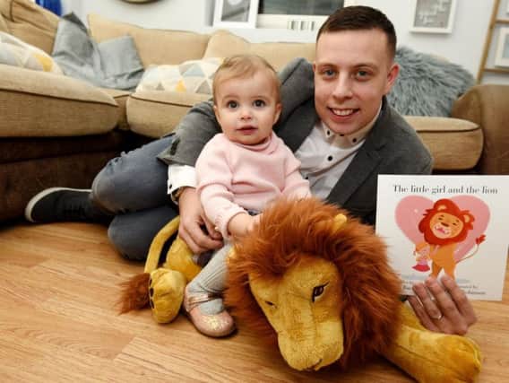 Matt Bacon with his daughter Savannah and his new children's book