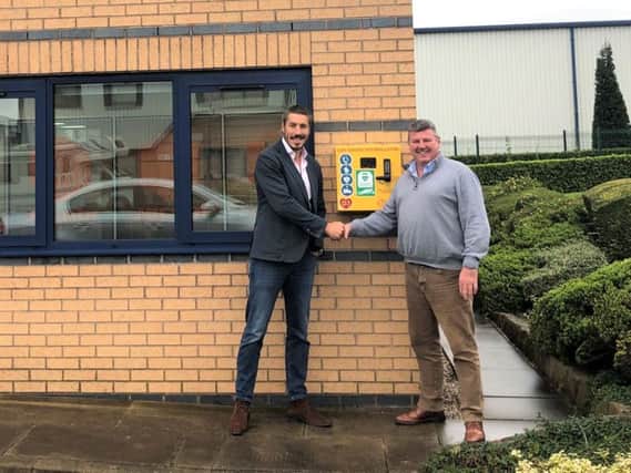 Sebastian Moss with Mark Downs as the new defibrillator is unveiled