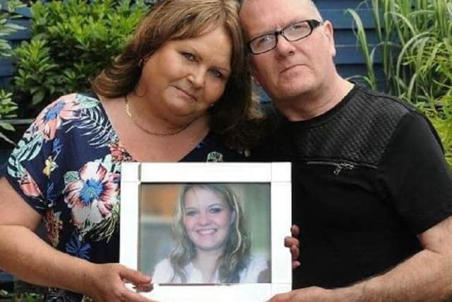 Sheila and Trevor Fairhurst with a picture of Carly