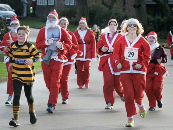 Competitors taking part in last years Santa dash in Mesnes Park. A second similar event will take place in Haigh Hall on the same day