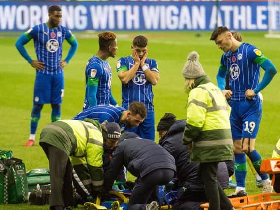 Sam Morsy looks on in horror as Joe Gelhardt is treated for a head injury before being stretchered off