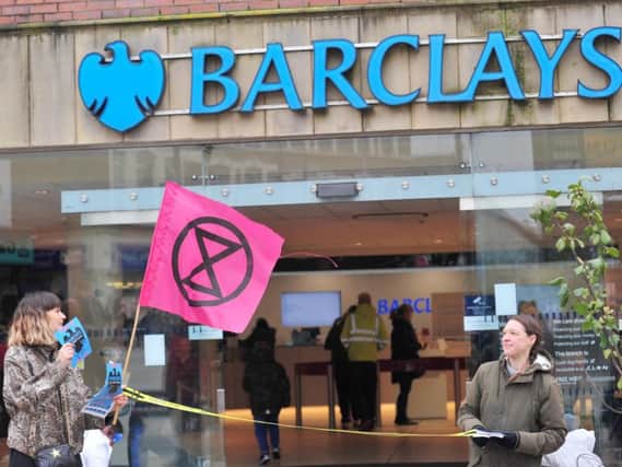 Demonstrators outside the bank