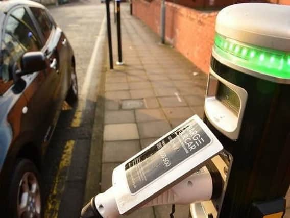 Electric charging points are few and far between in Wigan, but electric cars are growing in number