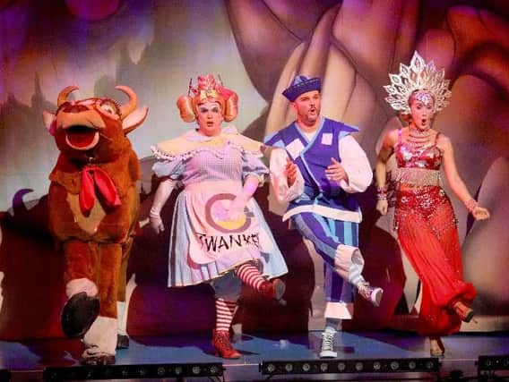 The panto cow, Widow Twankey (Si Foster), Wishee Washee (Scott Gallagher) and the Slave of the Ring (Jenna OHara) in Aladdin, at the Theatre Royal St Helens (Picture: David Munn)