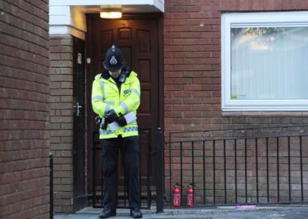 A Police officer stands outside the front door of the house in Chaucer Grove where Jade was tragically killed