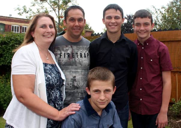 Jordan (centre) is pictured with his family, parents Meray and Paul and brothers Phil (12) and Jack (17)