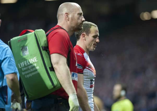 A groggy 
Lance Hohaia leaves the field at Old Trafford after the incident with Wigan's Ben Flower