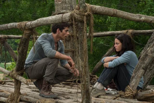 The Maze Runner - pictured: Dylan O'Brian and Kaya Scodelario