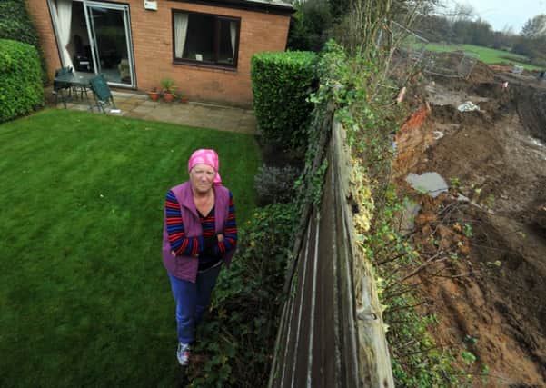 Cancer patient pensioner Margaret Holt in her garden