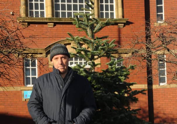 Michael Moulding from Ashton Residents Association with the Christmas Tree on Wigan Road, Ashton